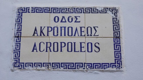 Tiles on a wall with the inscription 'AKROPOLIS' in blue letters, Lindos, Rhodes, Dodecanese, Greek