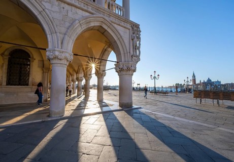 Colonnade of the Doge's Palace with Sun Star in the Piazetta San Marco, St Mark's Square, Venice,