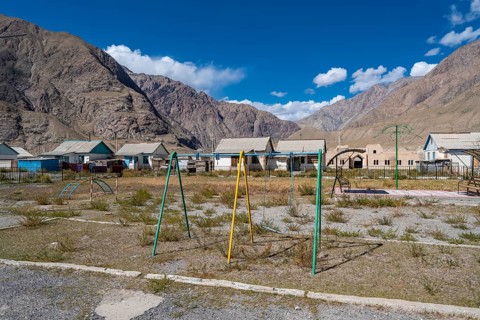 Swings on a playground, ghost town, Engilchek, Tian Shan, Kyrgyzstan, Asia