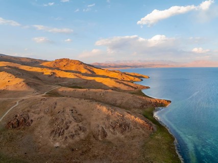 Aerial view, Vast empty landscape at the mountain lake Song Kul, Moldo Too Mountains, Naryn region,