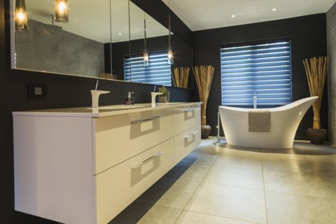 White high-gloss lacquered vanity with quartz countertop and his and her sunken sinks, freestanding