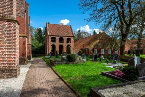 Protestant Reformed Church in Suurhusen, famous leaning church tower, municipality of Hinte,
