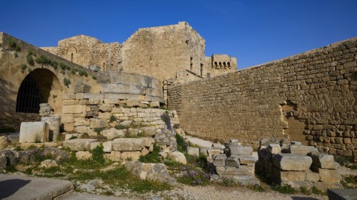 Ancient ruins with an arch and a clear view of the blue sky, St John's Fortress, Lindos, Rhodes,
