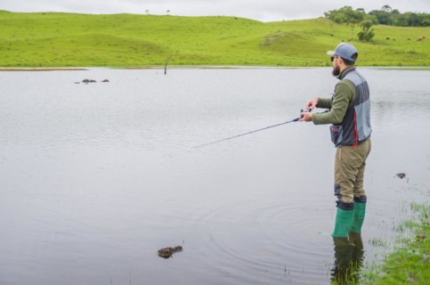 Black bass fisherman fishing with flyfishing, Cambara do sul, Rio Grande do sul, Brazil, South