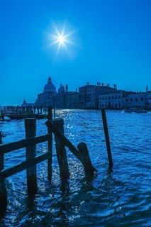 Silhouetted view of Grand canal with water taxis, Santa Maria della Salute basilica and Renaissance