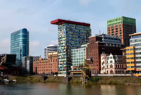 Left, office tower The Sign by architect Helmut Jahn, centre Colorium by architect William Allen