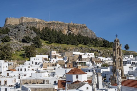 View of the Acropolis and the white houses of Lindos, Rhodes, Dodecanese archipelago, Greek