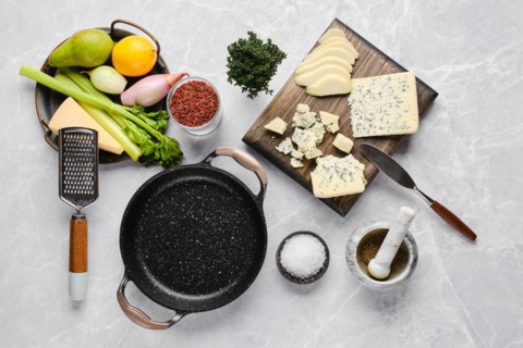 Top view of ingredients for risotto with pink rice, pear and blue cheese