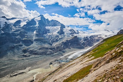 View from Franz Joseph Hoehe into the mountains (Grossglockner) with Pasterze on a sunny day at