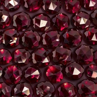 Pattern of gleaming garnets on a deep burgundy backdrop AI generated