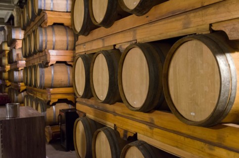 Oak barrels for wine aging in an underground cellar in Vale dos Vinhedos