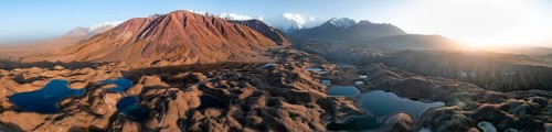 Aerial view, high mountain landscape with glacial moraines and mountain lakes, behind Pik Lenin,
