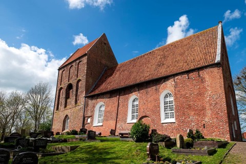 Protestant Reformed Church in Suurhusen, famous leaning church tower, municipality of Hinte,