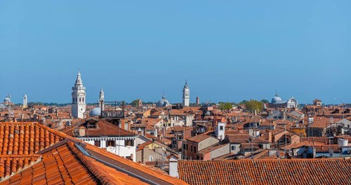View over the roofs of Venice with many church towers, view from the roof of the Fondaco dei