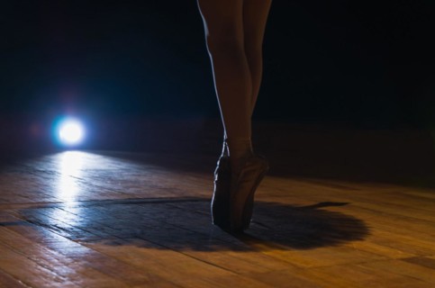 Closeup of ballet dancer legs on fingertips. Beautiful classical ballet composition. Poite