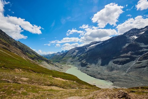 View from Wasserfallwinkelkeesee to Franz Joseph Hoehe into the mountains with Pasterze on a sunny