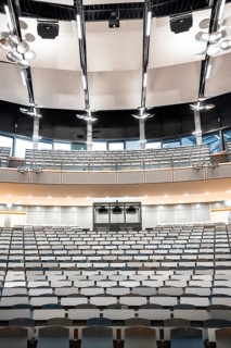 View from the lectern onto rows of seats in an empty lecture theatre, interior view, Department of