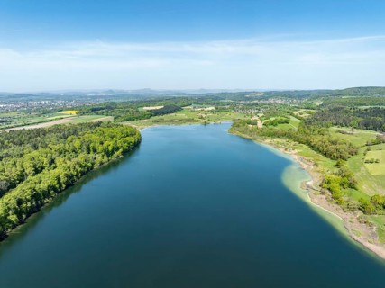 Aerial view of Lake Mindelsee, a glacial tongue lake on the Bodanrueck, with the Hegau Mountains on