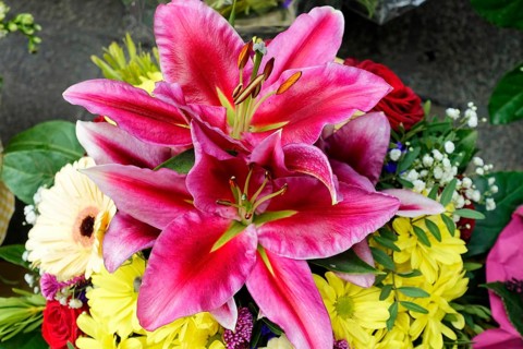 Lively bouquet with a large pink Lily (Lilium candidum) in focus, flower sale, Central Station,