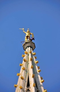 Gilded statue of the Archangel Michael fighting the dragon, the patron saint of the city of
