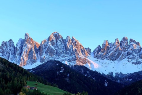 Mountain range in the evening light with snow peaks and deep blue sky, Italy, Trentino-Alto Adige,