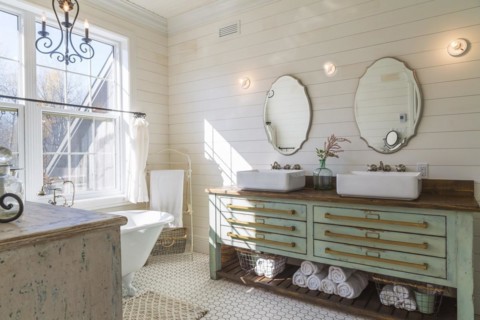 Green antique finish pine wood vanity with rustic wood plank countertop and white top-mounted his