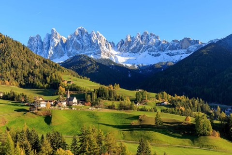 A small church in the midst of an autumnal mountain landscape in South Tyrol, Italy, Trentino-Alto