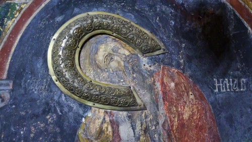 Detail of an Orthodox icon with a metallic letter and halo motif, fresco, Panagia Church, St Mary's