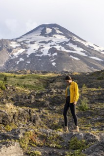 Young women in front of the volcano, Villarrica Volcano, Villarrica National Park, Araucania, Chil