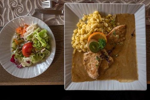 Pork schnitzel with spaetzle and salad plate, Franconia, Bavaria, Germany, Europe
