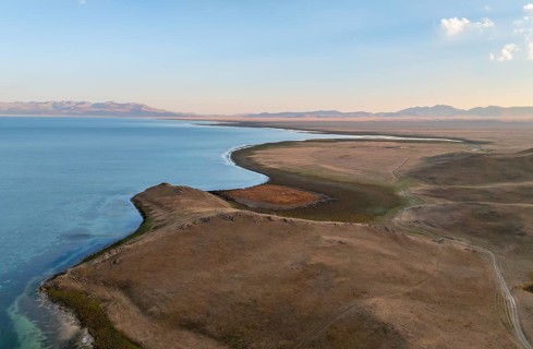 Aerial view, Vast empty landscape at the mountain lake Song Kul, Moldo Too Mountains, Naryn region,
