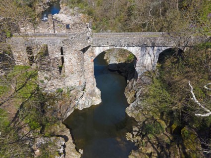 Historic bridge with an arch over a river, embedded in a natural landscape, Bridge of the Devil,