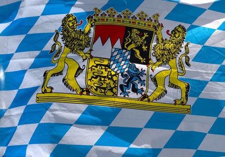 Bavarian flag with coat of arms moves in the Convolvulus