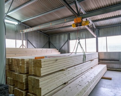 At sawmill. View on loading of wooden bars, close-up