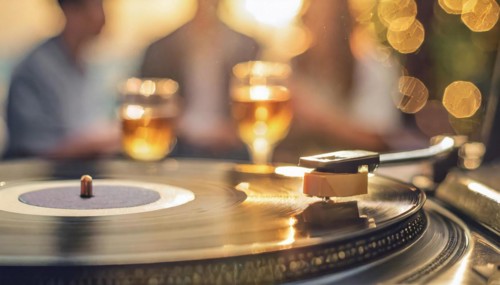 Close-up of a record player with vinyl disc playing, bokeh lights in the background, AI generated