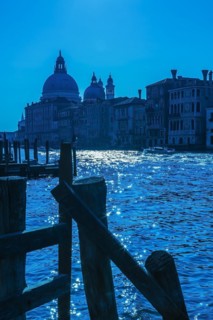 Silhouetted view of Grand canal with water taxis, Santa Maria della Salute basilica and Renaissance