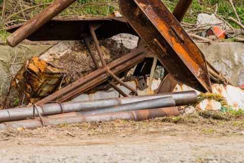 Closeup of large rusted metal anchor used on large fishing vessels in NamHae, South Korea, Asia