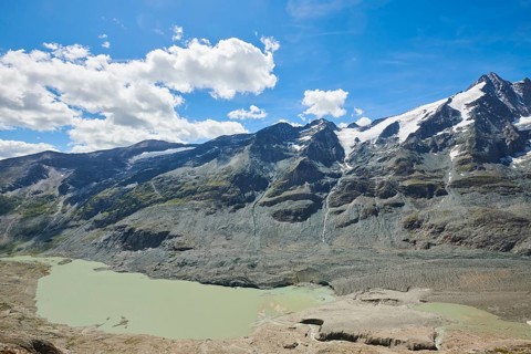 View from Franz Joseph Hoehe into the mountains (Grossglockner) with Pasterze on a sunny day at