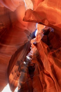 Naturally formed sandstone canyon with light shining through narrow openings, Upper Antelope
