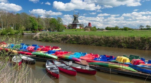 The Greetsiel twin mills, in front boats in the new Greetsieler Sieltief, Greetsiel, Krummhoern,