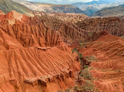 Badlands, canyon with eroded red sandstone rocks, Konorchek Canyon, Boom Gorge, aerial view,