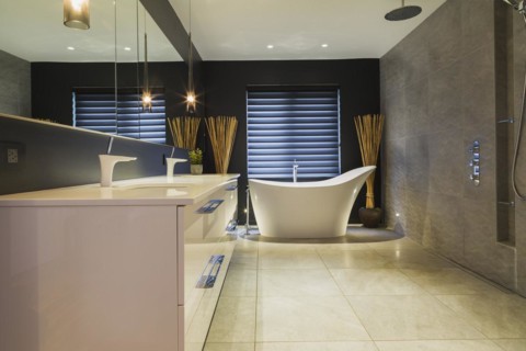 White high-gloss lacquered vanity with quartz countertop and his and her sunken sinks, freestanding