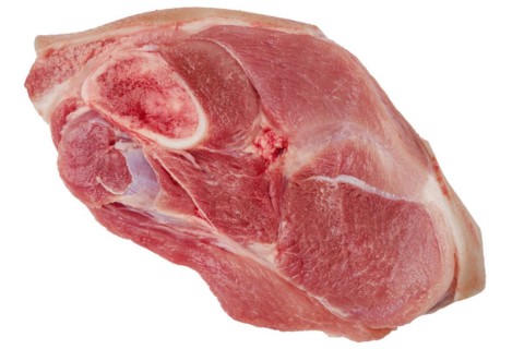 Top view of raw pork leg joint isolated on white background