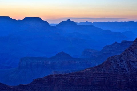 The twilight cloaks the Grand Canyon in a deep blue and emphasises the contours, Grand Canyon