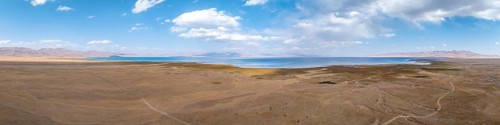 Aerial view, Vast empty landscape at the mountain lake Song Kul in autumn, Moldo Too Mountains,