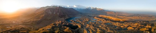 Aerial view, high mountain landscape with glacial moraines and mountain lakes, behind Pik Lenin,