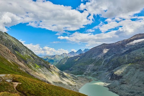 View from Wasserfallwinkelkeesee to Franz Joseph Hoehe into the mountains with Pasterze on a sunny