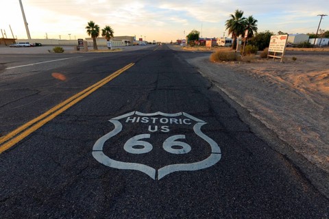 View of historic Route 66 at sunset with road markings and desert landscape, Historic Route 66,