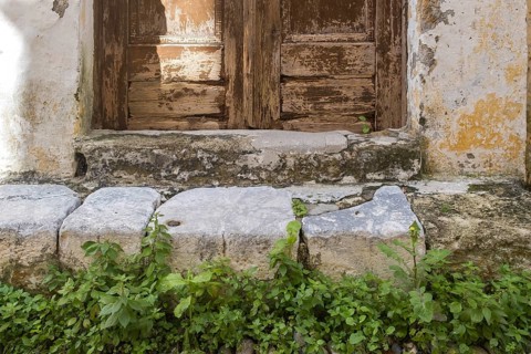 Old wooden door with step