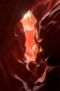 Dramatic lighting of a rock formation, centred light creates soft shadows, Upper Antelope Canyon,
